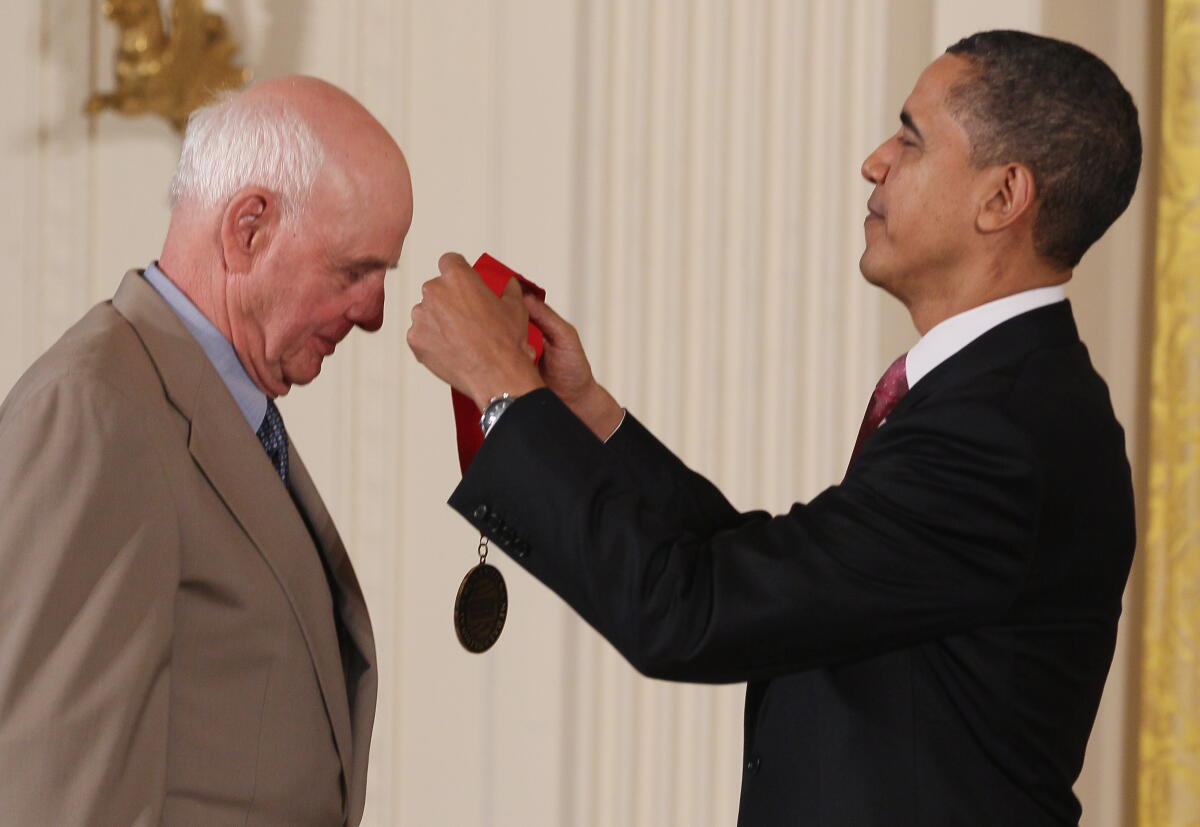 President Obama presents a medal to Wendell Berry