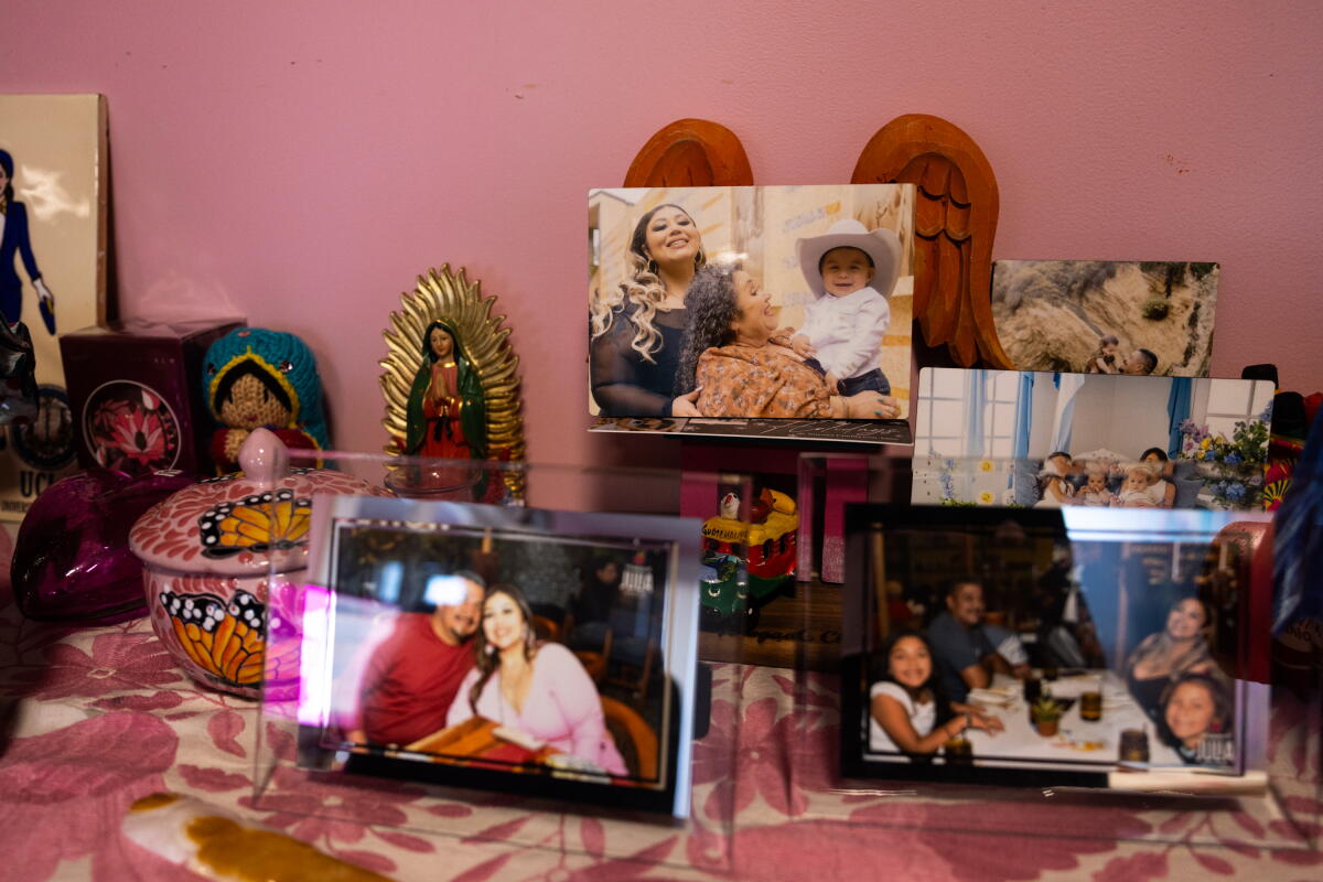 Family pictures sit in her office, including one of her mom and her son.