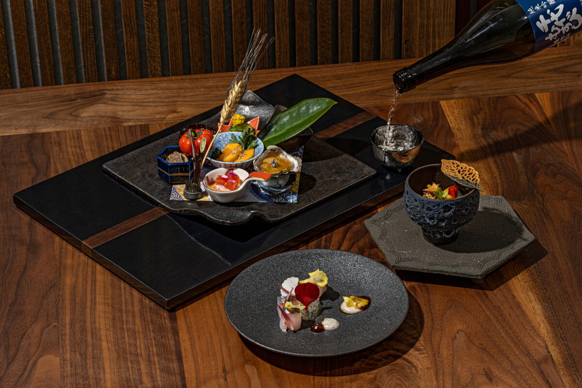 LOS ANGELES, CA - OCTOBER 18, 2022: Zensai, Modern Zukuri, Sakizuke and Sake pour at n/naka 