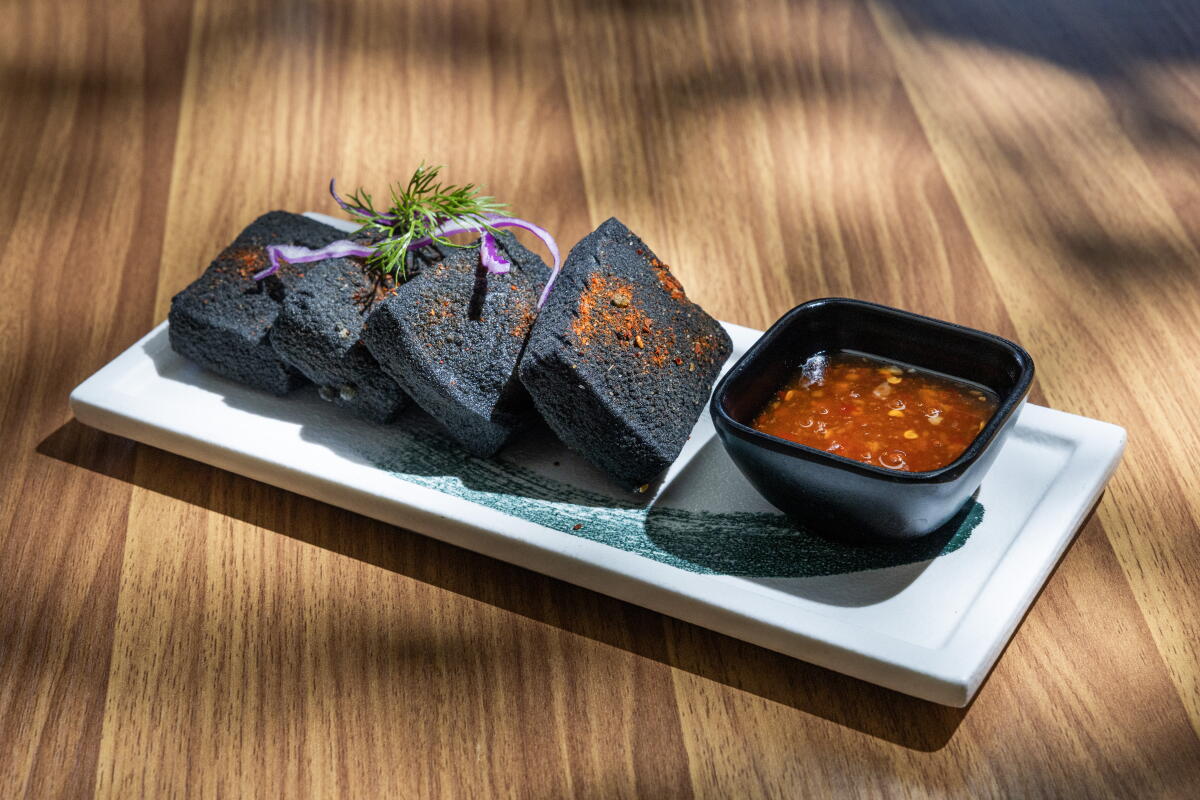 MONTEREY PARK, CA - AUGUST 28, 2026: Silky tofu battered with active charcoal and silky tofu at Nandao Rice and Noodle