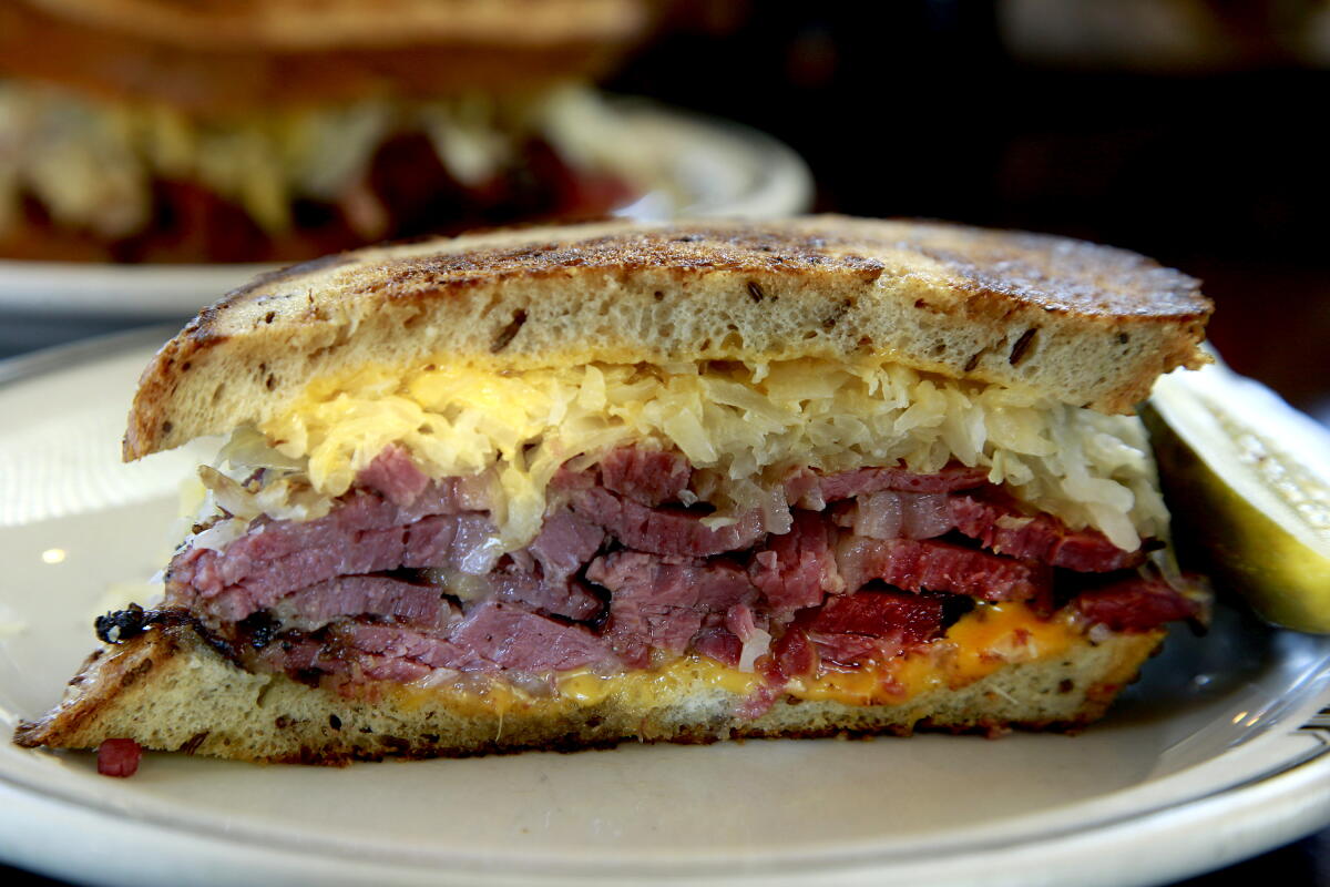 LOS ANGELES, CA., SEPTEMBER 14, 2016 -- THE RUEBEN - Hot Pastrami, sauerkraut and nappy cheese grilles on Rye bread is No. 44 on Langer's menu