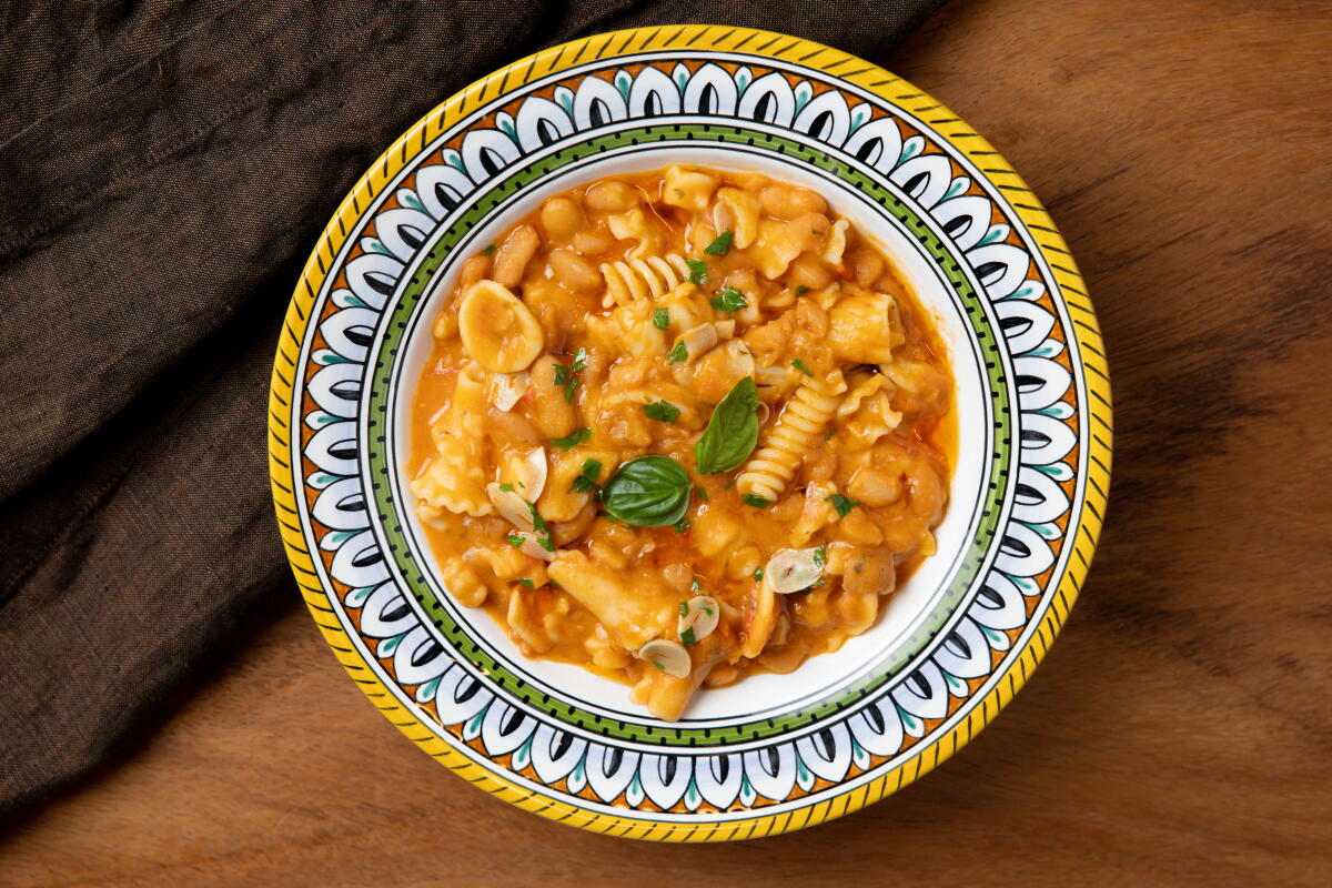 EL SEGUNDO, CA - AUGUST 6, 2026: A bowl of Daniele Uditi's pasta e fagioli made from peruano beans over cannellini beans