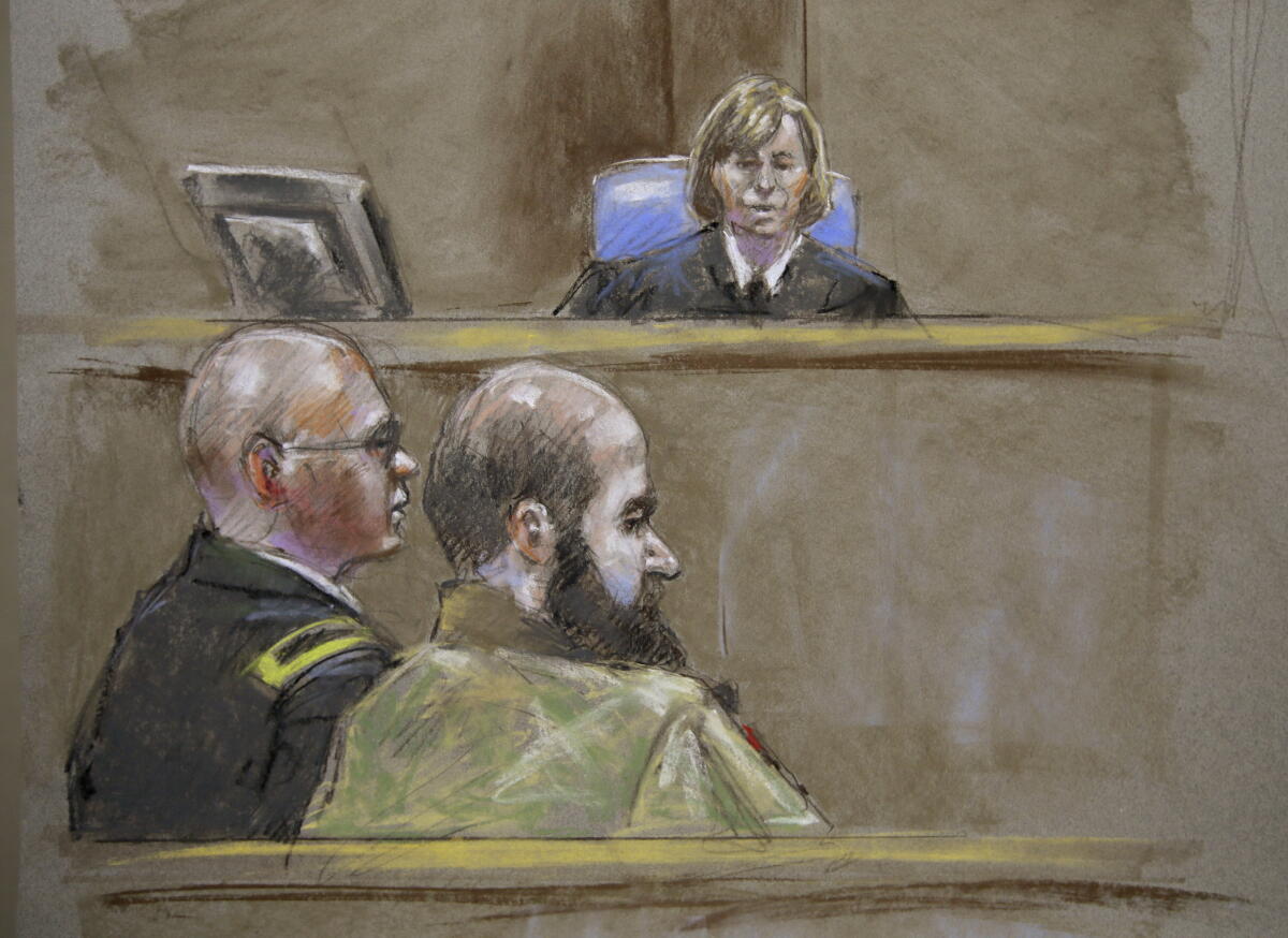Nidal Malik Hasan is shown in a courtroom sketch in 2013.