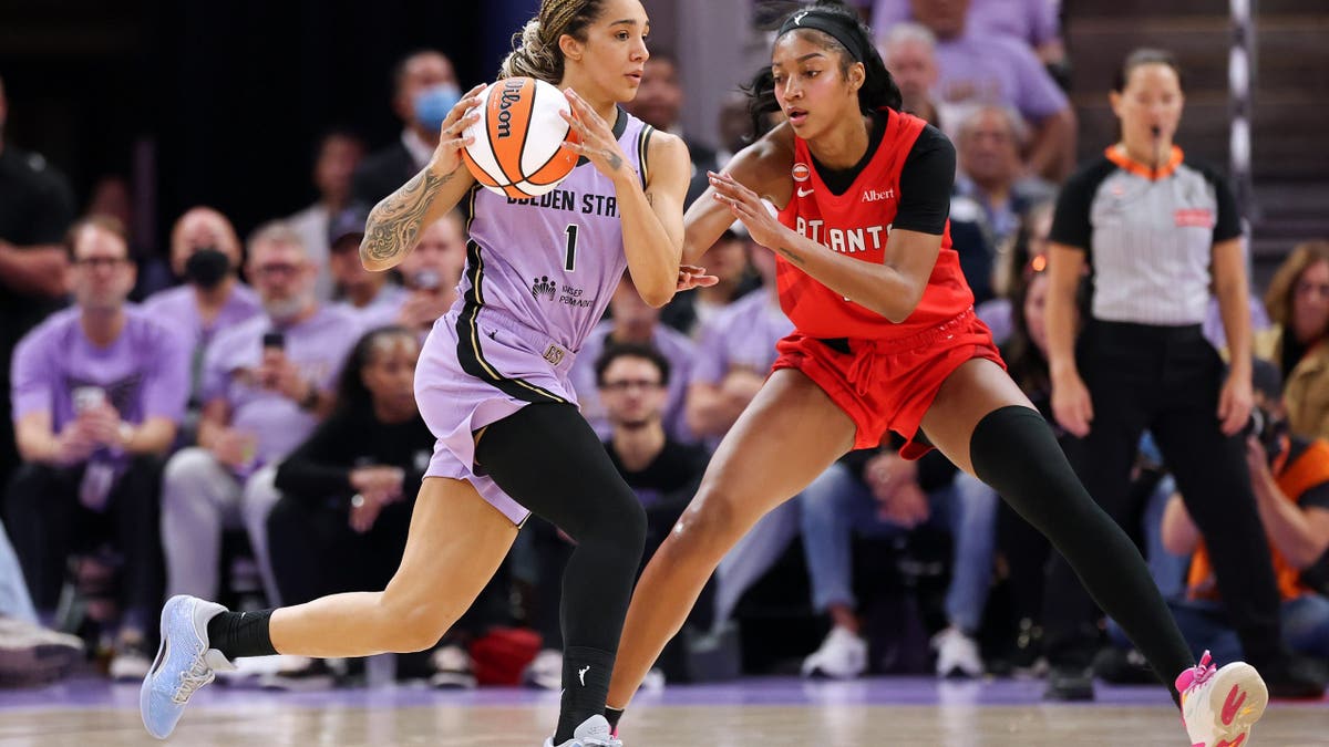 Gabby Williams #1 of the Golden State Valkyries is defended by Angel Reese #5 of the Atlanta Dream.